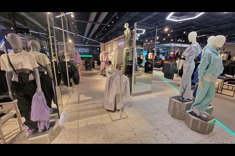 Interior of Footasylum store, Lakeside Shopping Centre, showing womenswear on display